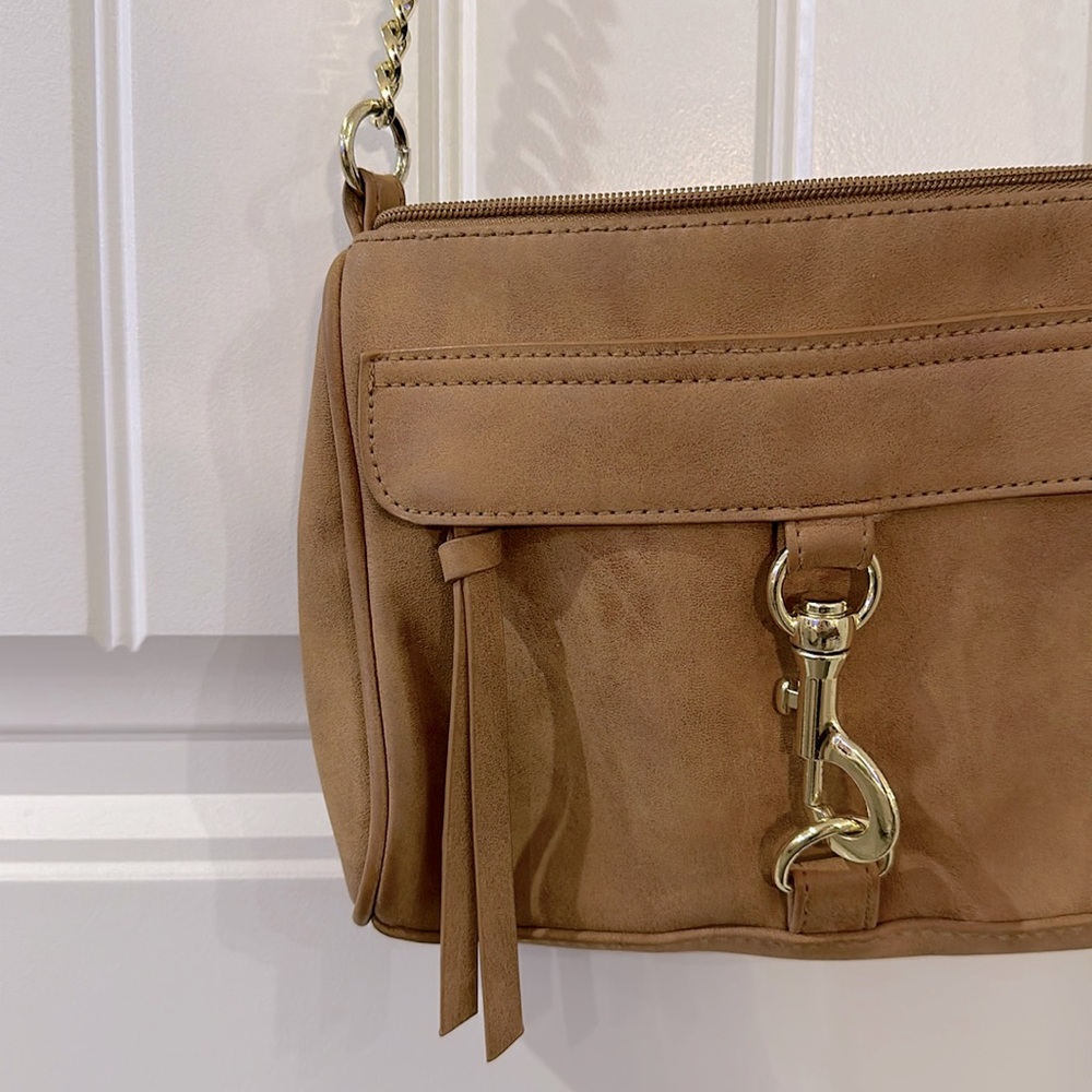 Brown suede crossbody bag with gold chain accents